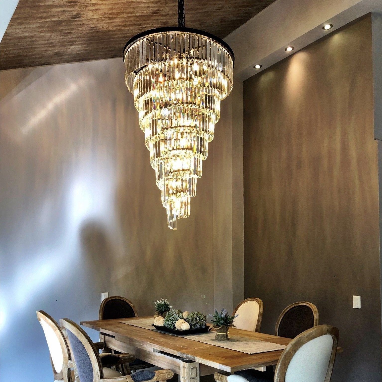Veccini Odeon spiral tiered crystal fringe chandelier installed above dining table