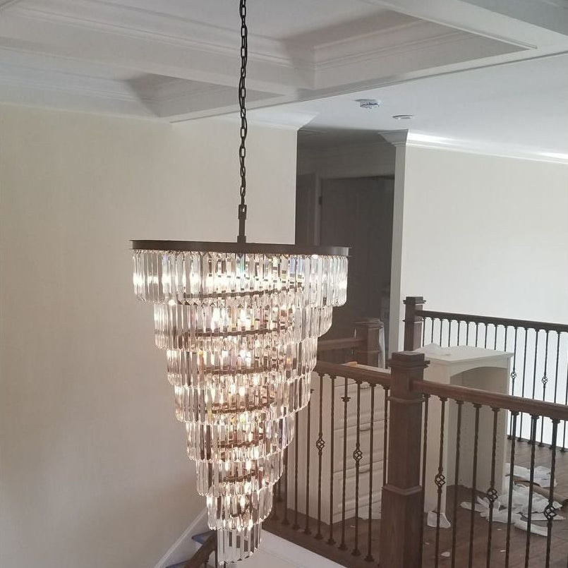 Detail of spiral tiered frame and crystal fringe on Veccini Odeon chandelier with polished metal finish